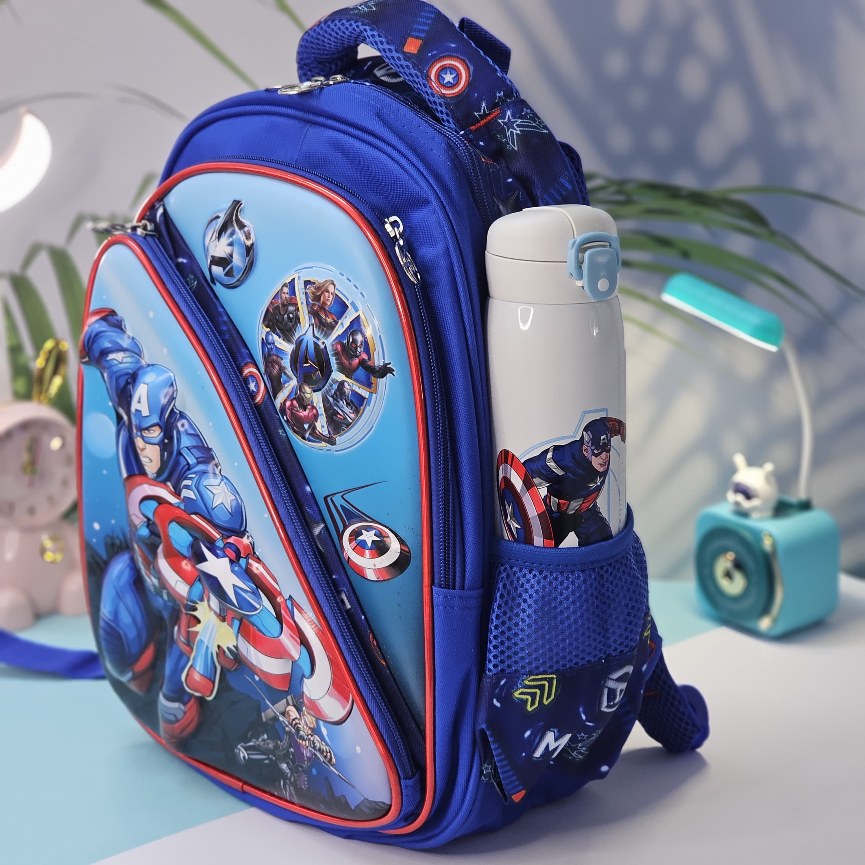 Front view of an Usmile Toys superhero backpack for kids, displaying detailed illustrations of Iron Man and other Avengers characters, suitable for school or travel." www.usmile.toys